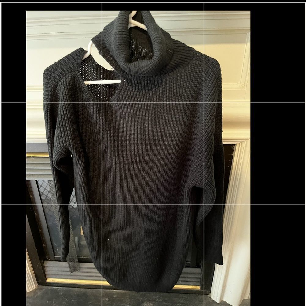 Black turtle neck with open shoulder
